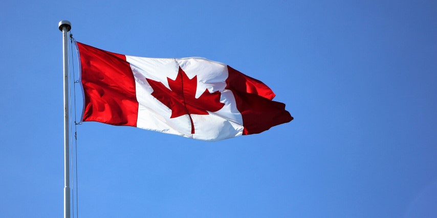 Canadian flag raised above Parliament Hill, Ottawa.
